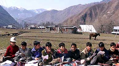 Students attend an open air class near the Indo-Pakistan border