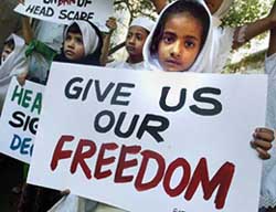 Muslim girls demonstrate in front of the French consulate in protest against the French Government's move to ban veil in government schools in Mumbai on Wednesday.