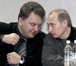 Russian President Vladimir Putin, right, listens to Deputy Prime Minister Viktor Khristenko