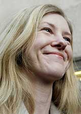 Former employee of Britain's global surveillance centre GCHQ Katherine Gun smiles outside the Old Bailey in London