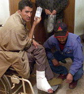 An injured man in a wheelchair at a hospital in Srinagar on Thursday. He was one of the casualties of the police firing to disperse demonstrators protesting against human rights violations. 