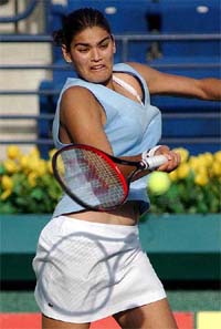 Eleni Daniilidou of Greece hits a forehand return to Jennifer Capriati of the US 