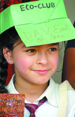 A student dons the eco-friendly cap during the Annual Eco Meet 2004, organised by the Environment Ministry at Bal Bhavan in the Capital