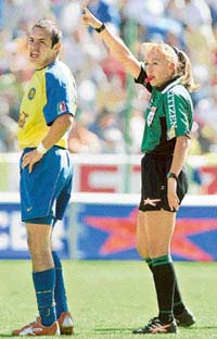 Virginia Tovar, the first female referee in Mexicos professional soccer league, makes a call alongside Americas Cuauhtemoc Blanco