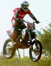 Defending champion C Vijaykumar of Team TVS soars high over a jump during the MRF National Motocross Championship-2004 at the Circus Ground, Sector 17, Chandigarh