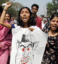 Students of Dhaka University stage a protest on Sunday, against an attack on their teacher Dr Humayun Azad, who is also an author and literary personality in Bangladesh. Azad was hit with choppers and home-made bombs by unidentified attackers as he walked out of a book fair near the university on Friday evening. 