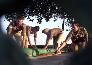 BSF jawans clean the tomb of a Muslim Sufi saint