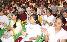 Prize winners of MCM DAV College, Sector 36, applaud the performance of a fellow student at the annual prize distribution function