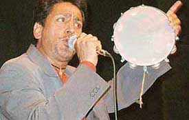 Punjabi singer and actor, Gurdas Mann, sings his message for the girl child and (Right) prize winners of MCM DAV College, Sector 36, applaud the performance 