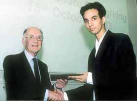 Mukul Tuli of Rajinder Nagar receiving the KPMG Prize for Best Performance in Professional Accounting and Information Management (Module 2) from Sir Peter Phillips OBE.