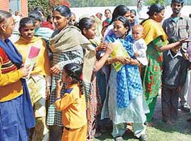 Women enrolled with the UT Adult Education Department in a cheerful mood after taking their first exam at Government High School, Sector 25