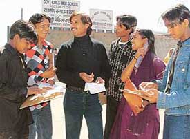 Zulfiqar Khan of Theatre Age with slum children who took the Class V exam at Government Model High School, Sector 25
