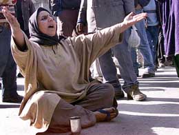 A Kashmiri woman cries while protesting against the arrest of her son, Mohammed Yousaf, by security personnel in Srinagar on Thursday.