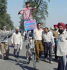 Rajeev Kumar, alias Johny, from Chandigarh on his 7.6-foot bicycle at the kisan mela at Punjab Agricultural University