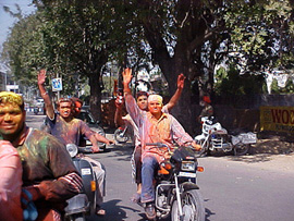 A group of Holy revellers ride two-wheelers without helmets in front of the Model Town gurdwara in Jalandhar on Saturday. Photo: S.S. Chopra