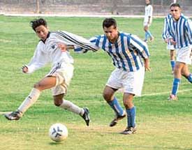The teams of Punjab Radio Sporting Club, Coventry, UK and St Stephens Club in action in a football match in Chandigarh 