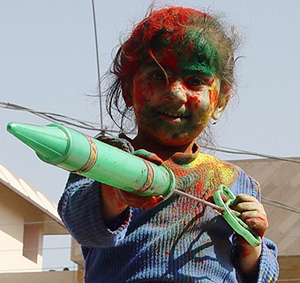 A child plays Holi in Ambala on Sunday