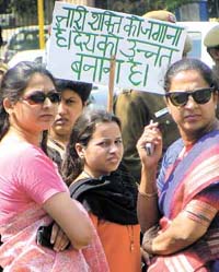 Women take part in a rally organised by YWCA to mark International Women's Day in the Capital on Monday