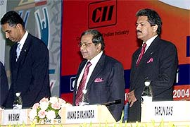 Chairman of Young Indians G.V. Sanjay Reddy, Planning Commission member N.K. Singh and CII President Anand Mahendra at the inaugural session of the first Young Indians Summit 2004