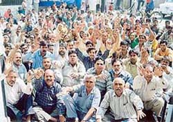 Led by activists of the Sangharsh Committee, municipal employees hold a protest rally to press for their demands in Ludhiana on Wednesday.