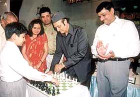 Dr Karan Singh, MP, makes the first move against Parimarjan Negi to inaugurate the second Parsvnath International Open Chess tournament at the Bapu Sewa Samaj Kendra at Panchkuiyan Road