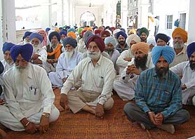 Members of the Poohla Eviction Committee, headed by Col G. S. Sandhu (retd) at a meeting in Bhikhiwind on Wednesday.