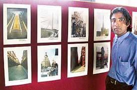 Rajender Kumar with some of his images of Spain at the Chandigarh College of Architecture gallery on Thursday.