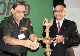 Lt-Gen R. C. Dhir, DG, Dental Services, and Mr Sudershan Banerjee, Founder Chairman, Sehat Foundation, lighting the lamp at the launch function of the foundation in the Capital