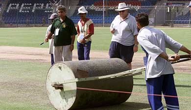Pitch expert ND Atkinson supervises work on a pitch at National Stadium in Karachi