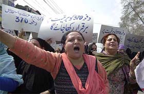 Kashmiri women demonstrate in support of the permanent residents bill in central Srinagar