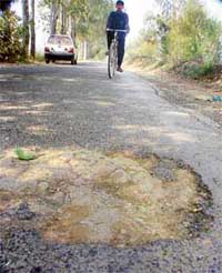 The damaged Khanna-Khamano road which was recarpeted four months ago
