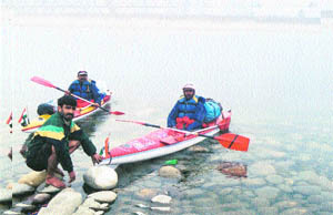 Kayakists interacting with villagers in Uttaranchal