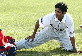 Indian bowler Irfan Pathan stretches during a training session in Rawalpindi