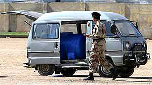 A soldier examines a van carrying explosives and detonators in Karachi