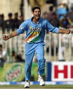 Yuvraj Singh celebrates after taking the wicket of Pakistans Shahid Afridi