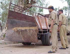 Police personnel inspects the canter in which three students were killed in Ambala
