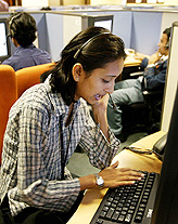 An employee at a call centre provides service support to international customers in Bangalore . The $3.6 billion industry in India is seen rocketing to $13.8 billion by 2007 with the number of jobs quadrupling to 1 million.