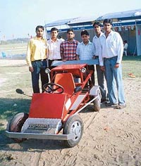 Mechanical engineering students of Shaheed Udham Singh College of Engineering and Technology, Tangori, pose with a single-seater car which they fabricated from scrap.