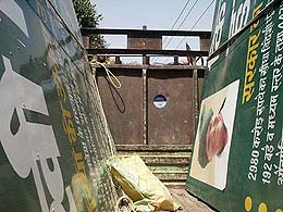Hoardings highlighting the achievements of the INLD government, which were removed from the national highway in Panipat, being loaded in a truck