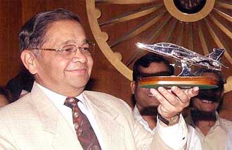 Defence Secretary Ajay Prasad looks at a model of Hawk AJT 