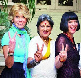 Hollywood actress Jane Fonda together with Indian television and theatre actress Dolly Thakore (centre) and playwright Eve Ensler, make a V-sign on International Womens Day in Mumbai