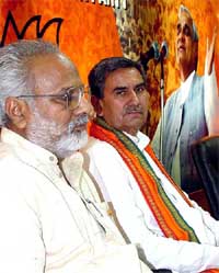 A former HVP leader from Bhiwani, Mr Om Parkash Singh Mann, who has joined the BJP, with partys Haryana Pradesh president Ganeshi Lal at a Press conference in New Delhi 