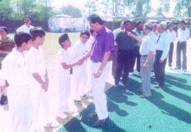 Chief guests L. R. Chaman and S. K. Bhattacharya meeting players at the inauguration of the Pankaj Jain Under-14 Inter-School Cricket Tournament.