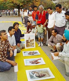 Imran Mani, Saquib Rafiq and Akram Waraich (extreme left) from Wazirabad, display art works which they are using to locate displaced Wazirabadis. The display was put up at Sector 17 Plaza on Tuesday.