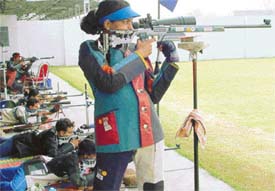 National shooter Anuja Tere aims her shot in the three position air rifle event in the inter-Railway shooting meet at Mohali on Tuesday. 