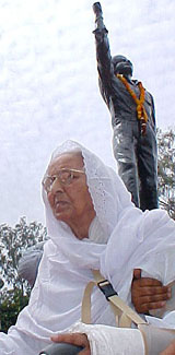 Ms Parkash Kaur, sister  of Shaheed Bhagat Singh, sits in front of her brother's statue at Khatkar Kalan village on Tuesday