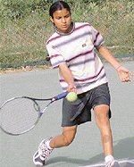 Navjot Saini of Punjab  plays a forehand shot to move in the third round of the girls under-18 section of the AITA Talent Series Tennis Tournament at CLTA Tennis Stadium, Sector 10, Chandigarh, on Wednesday. 