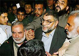 Hamas leader Abdel Aziz Rantisi is mobbed by supporters as he makes his way through the crowd after being elected the new leader of the Hamas 