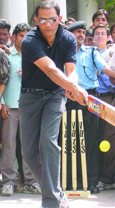 Former Indian captain Mohd. Azharuddin entertains the crowd at a Connaught Place street corner 