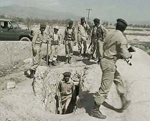 Pakistan troops exit from a tunnel near Wana in the South Waziristan tribal area of Pakistan